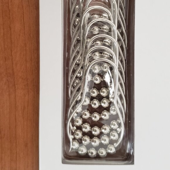 Shower curtain rings - still in the package - never used. - Picture 1 of 3